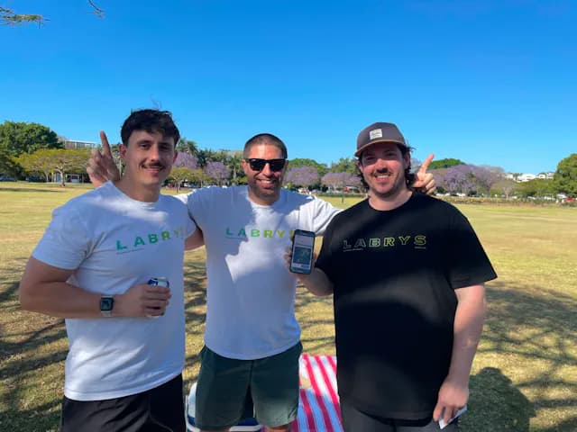 Winning Labrys team celebrating at the park after minting the Infinity Labrys NFT